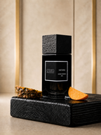 SOVRAI Maturus 30ML extrait de parfum bottle displayed on a black wooden pedestal with pineapple and mango accents.