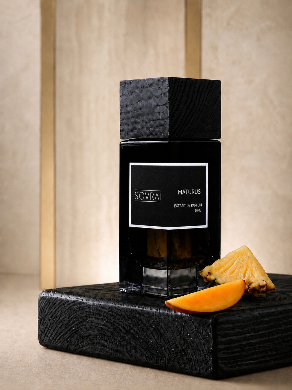 SOVRAI Maturus 50ML extrait de parfum bottle on a black wooden pedestal with pineapple and mango accents.