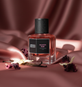 SOVRAI Palace in Rose extrait de parfum bottle on pink satin with rose petals
