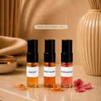 SOVRAI Discovery Set I with three 2 mL extrait de parfum sample vials in a warm luxury studio setting.