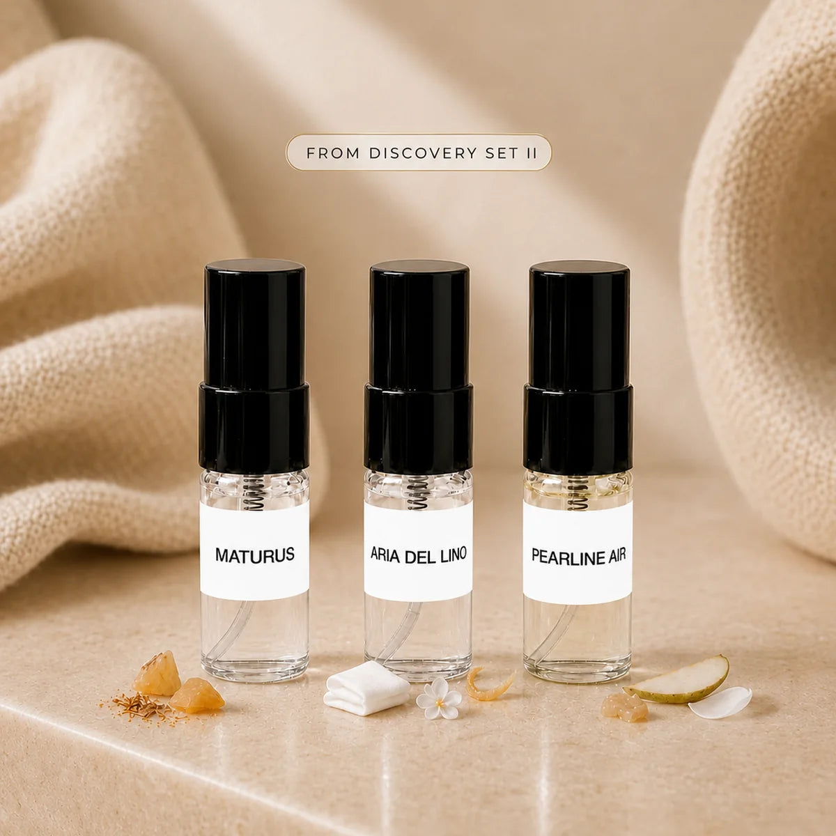 SOVRAI Discovery Set II with three 2 mL extrait de parfum sample vials in a soft beige luxury studio setting.