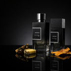 Maturus perfume bottles in 50ML and 100ML sizes on a reflective black surface with pineapple and dried mango accents.