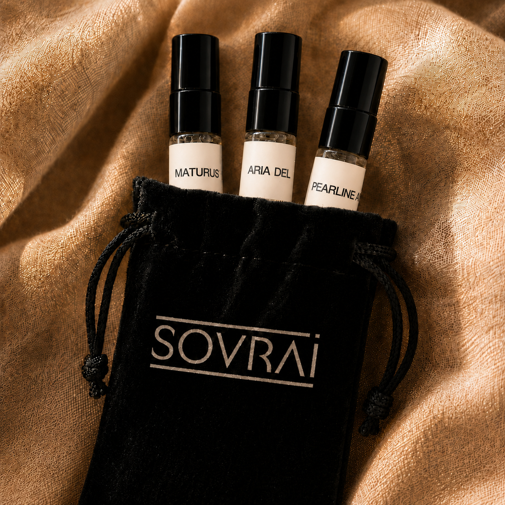 SOVRAI Discovery Set II perfume samples featuring Maturus, Aria del Lino, and Pearline Air in a black branded pouch on textured bronze fabric.