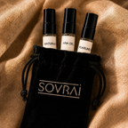 SOVRAI Discovery Set II perfume samples featuring Maturus, Aria del Lino, and Pearline Air in a black branded pouch on textured bronze fabric.